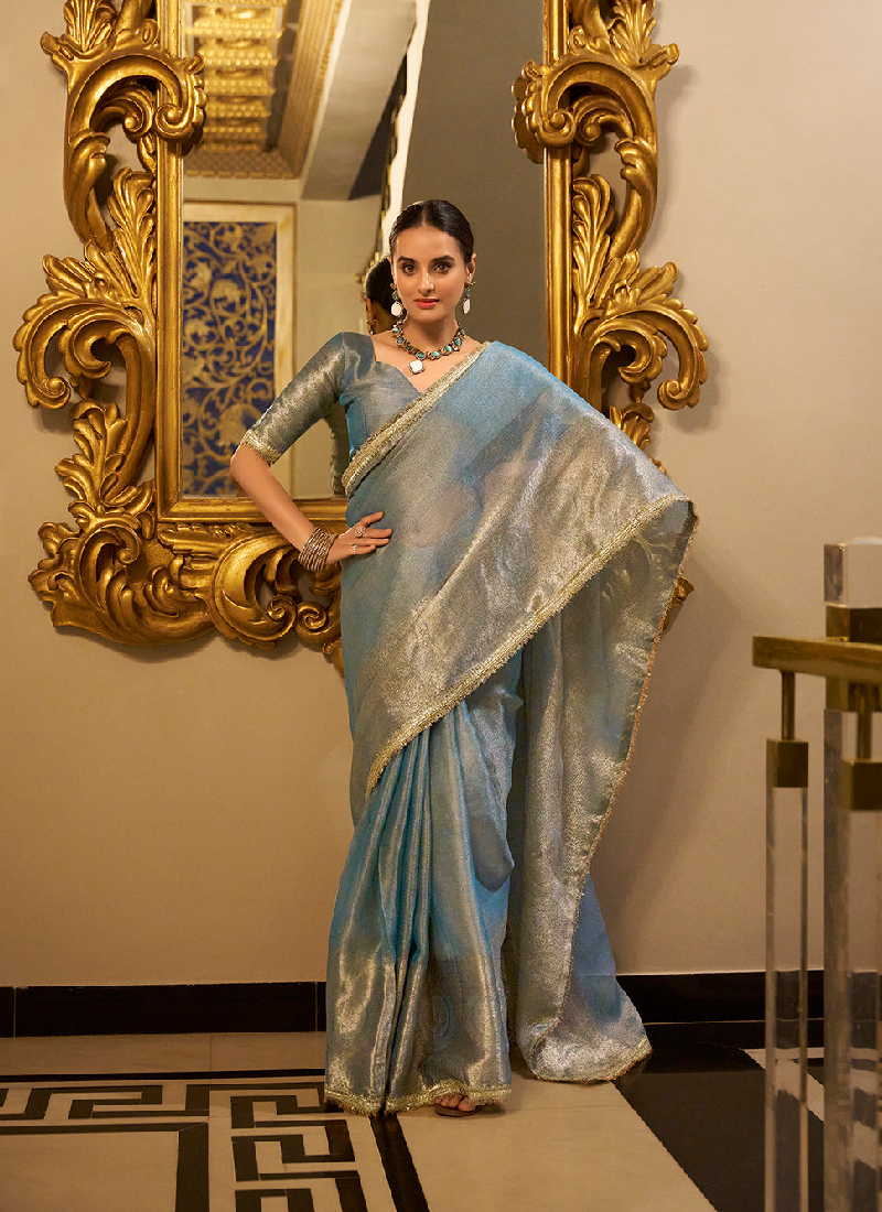 Party wear Sky Blue Tissue shimmer saree with zari weaving and sequin lace.