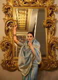 Party wear Sky Blue Tissue shimmer saree with zari weaving and sequin lace.