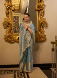 Party wear Sky Blue Tissue shimmer saree with zari weaving and sequin lace.