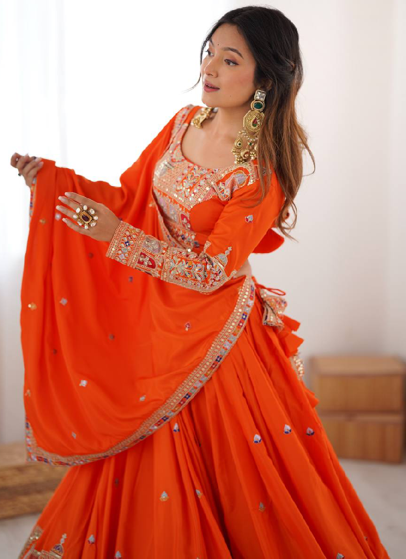 Amazing Party wear Orange Crepe Silk lehenga choli embellished with sequin coding work.