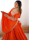 Amazing Party wear Orange Crepe Silk lehenga choli embellished with sequin coding work.