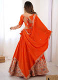 Amazing Party wear Orange Crepe Silk lehenga choli embellished with sequin coding work.