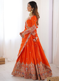 Amazing Party wear Orange Crepe Silk lehenga choli embellished with sequin coding work.