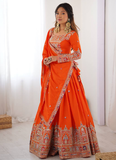 Amazing Party wear Orange Crepe Silk lehenga choli embellished with sequin coding work.