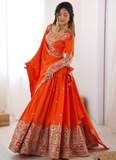Amazing Party wear Orange Crepe Silk lehenga choli embellished with sequin coding work.