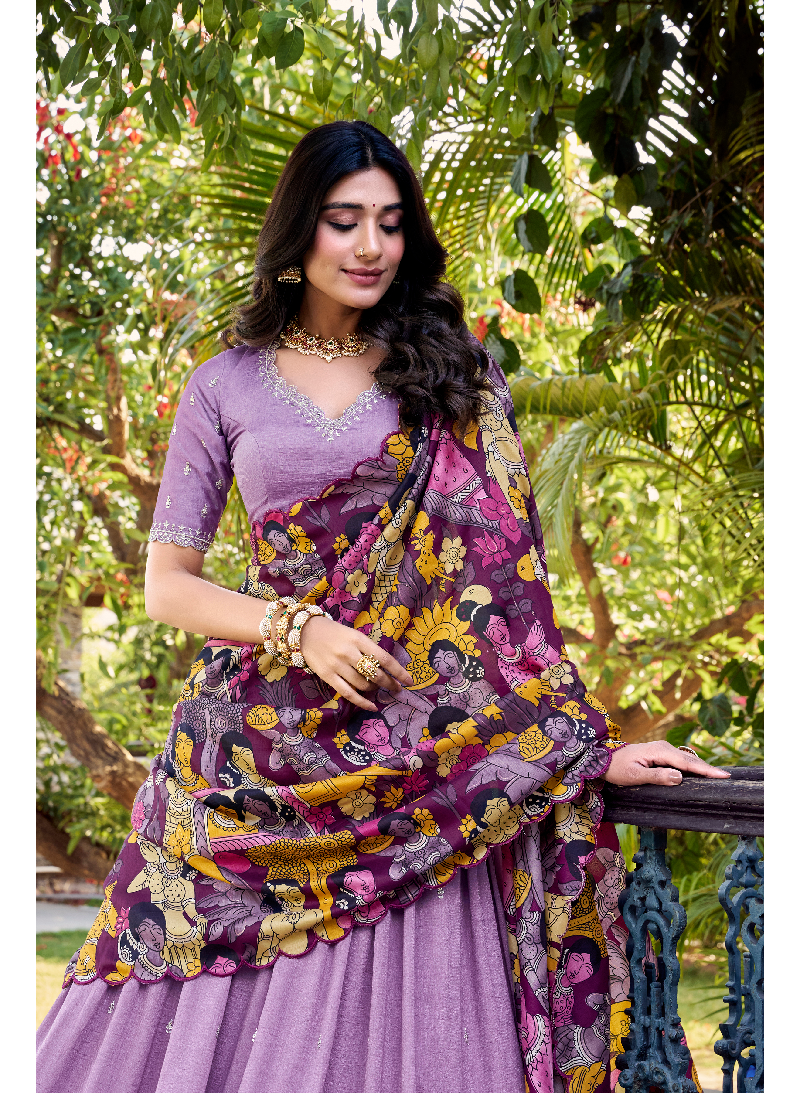Alluring Lavender SIlk lehenga choli with sequin embrodiery and kalamkari print border.