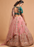 Real Mirror With Embroidered Work Soft Net Peach Lehenga Choli