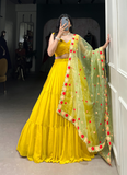Haldi ceremony ruffle georgette lehenga choli paired with floral organza dupatta.
