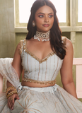 Amazing white soft net lehenga choli with sequin and zari embroidery work